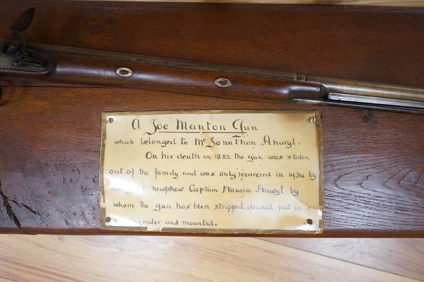 A single barrel flintlock sporting gun by Manton, half stocked, with signed lock and rainproof pan, platinum lined vent, and iron furniture (worn smooth)